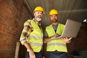 cheerful-devoted-construction-workers-in-safety-ve-2024-11-11-03-49-49-utc