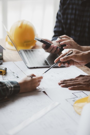group-architects-and-engineers-are-in-a-meeting-to-2023-11-27-05-33-24-utc